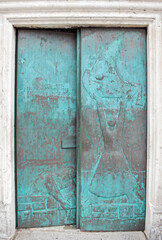 I liked this door so much, I photographed it during our honeymoon in Montenegro. It is the entrance to the church called Lady of the Rocks. This church is located on an island in Perast Montenegro.

T