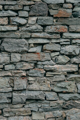 An old stone medieval wall, a natural background, a replica of the cosmos.