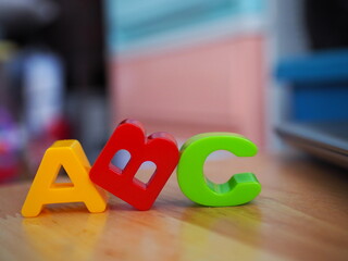 ABC alphabet blocks on wood desk. 