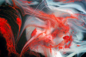 Expressive swirls and mixing of white and red in the dark.  Natural texture with depth and layering...