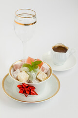 Traditional Turkish Delight on fabric napkin with Turkish Coffee.The Sugar Festival.