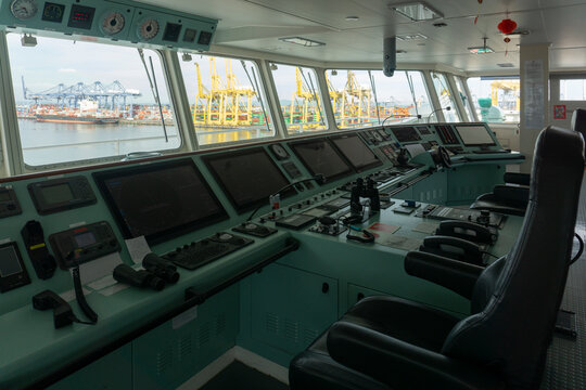 Control room of cargo ship on the top bridge for navigation at sea.	
This cargo ship's control room with communication devices.