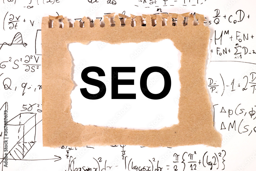 Aufkleber seo text on white paper surrounded by mathematical formulas. isolated on white.