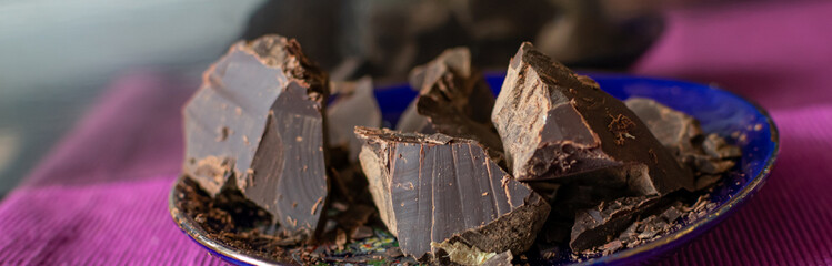 Broken pieces of dark bitter chocolate