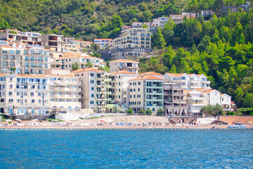 Fototapeta premium Coastal touristic resorts . People on the beach . Summer vacation
