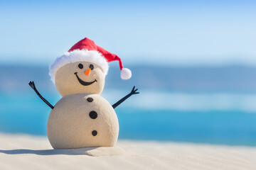 Sandy Christmas Snowman is welcoming the New Year on a beautiful beach
