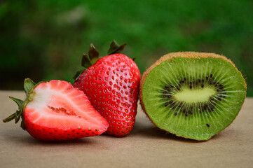 two juicy fresh strawberries and a kiwi