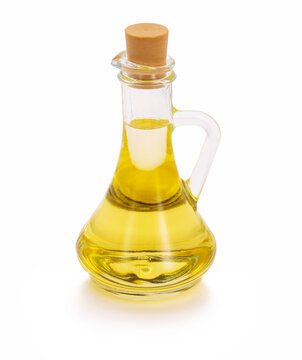 Glass bottle of olive oil on white background