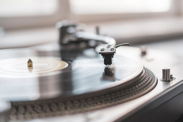 macro close up record player needle playing the vinyl disc, old fashioned retro music player