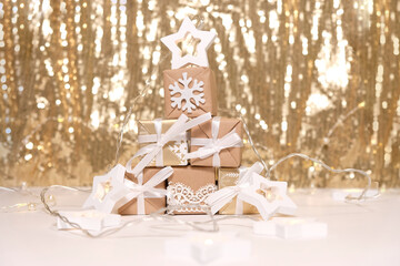 Blackground of abstract glitter lights. Gold and white. De focused.