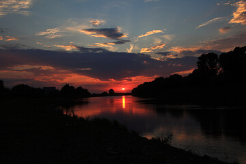Sunset in the delta of the Volga River on the river Baklanya. The Astrakhan region. Russia.Blurred...