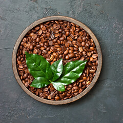 Roasted coffee beans on  concrete background