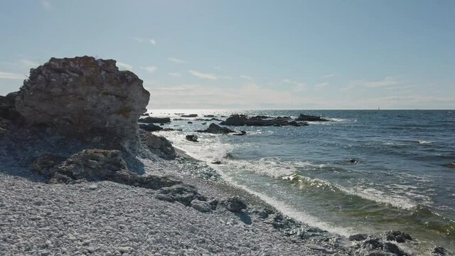 Beautiful seascape with Rauk formation. Handheld, pan right