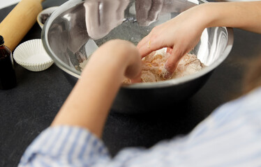 food cooking, baking and culinary concept - close up of hands making shortcrust pastry at bakery