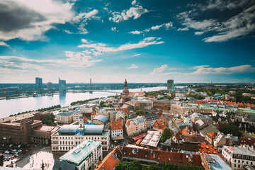 Fototapeta na wymiar Riga, Latvia. Riga Cityscape Slyline In Sunny Summer Day. Famous Landmarks - Riga Dome Cathedral And St. James's Cathedral, or the Cathedral Basilica of St. James