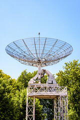 The 10-meter across radio telescope in the parc de la Villette in Paris, France, against blue sky.
