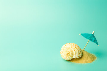 Vacation, summer, relaxation and sea concept background. Minimal creative composition with sand and umbrella on a colored clean background.