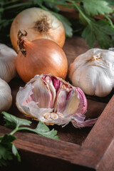Garlic and onion in wooden box