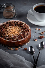 Homemade pie with nuts and chocolate ganache