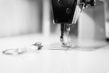 Sewing machine. Sewing clothes to make a black suit. Unemployed. 