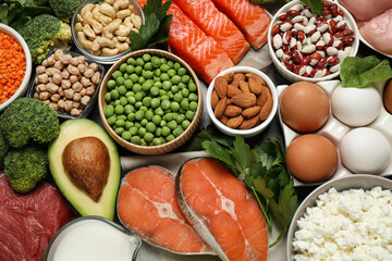 Products rich in protein as background, flat lay