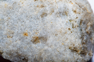 Stone surface texture at high magnification with numerous microscopic formations of natural quartz crystals