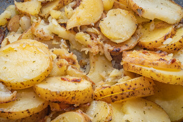 Hot baked potatoes with thin-skinned slices. A simple and quick after-work meal for the worker and bachelor