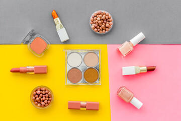 Beauty cosmetics and makeup products on colorful background. Flat lay, top view