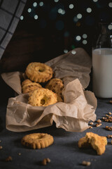 Sweet cookies with nuts in dark background
