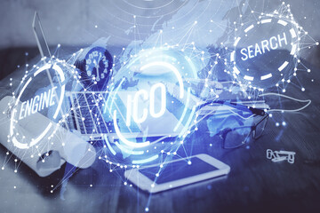 Double exposure of blockchain and crypto economy theme hologram and table with computer background. Concept of bitcoin cryptocurrency.