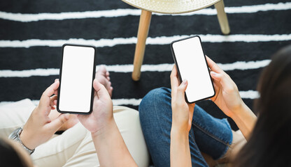 Woman hand holding smartphone and touching blank screen. Mockup of advertisement.