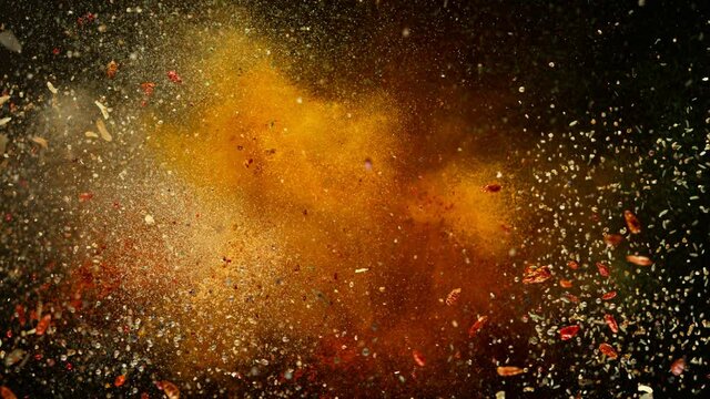 Super slow motion of flying spices mix with ramp speed motion. Filmed on high speed cinema camera, 1000 fps