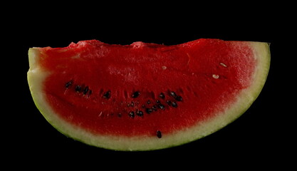 Fresh watermelon slice isolated on black background