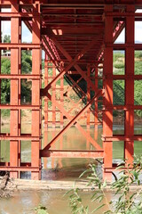 Fototapeta na wymiar red bridge over the river