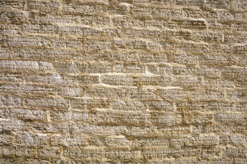 stone wall of roughly cut limestone blocks of different sizes as a background