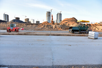 Paving roller machine during road work. Road roller at construction site for paving works....