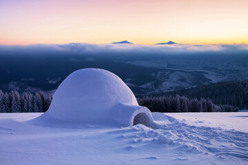 Igloo the house of isolated tourist is standing on high mountain far away from the human eye....