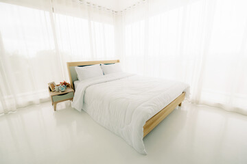 Fototapeta na wymiar White minimalist bedroom interior at morning with sunlight.