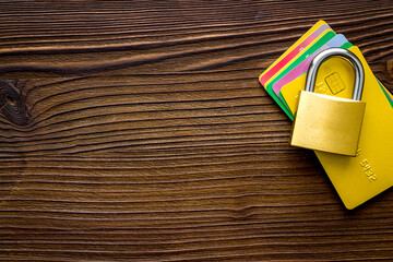 credit card with security lock on wooden desk top view copy space