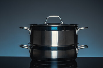 New cookware on black background, front view