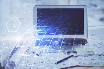 Multi exposure of table with computer and world map hologram. International data network concept.