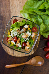 Homemade chicken salad in a glass bowl.