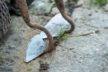Two different sized hoes after working in the ground. Agricultural tool
