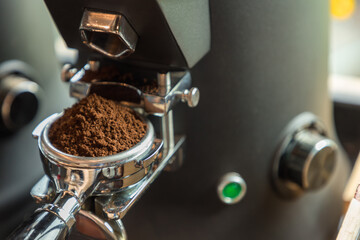 Coffee extraction from professional coffee machine. coffee machine preparing fresh coffee and pouring into cups at restaurant, bar or pub. Espresso shot from machine.