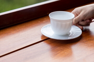 empty white coffee cup  or tea cup on wood table. 