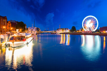 The old town of Gdansk with ferris wheel at night, Poland