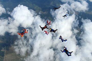 Fototapeta na wymiar A group of skydivers is in the sky.