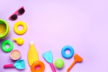 Set of beach accessories for children on color background