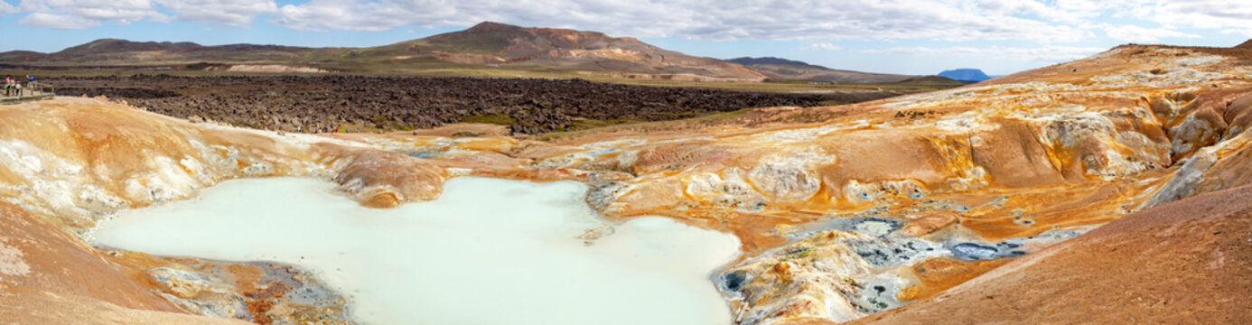 LEIRHNUKUR, ICELAND: Slopes Of A Volcano Full Of Hot Springs, Steaming Fumaroles And Black Lava Fields; In The Background Krafla Volcano