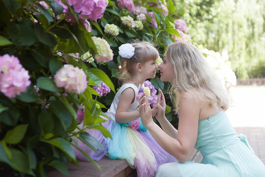 Loving Young Mother Laughing Embracing Smiling Cute Funny Baby Daughter Enjoying Time Together At Home, Happy Family Lonely Mom With Little Baby Girl Fun Play Feel Joy Hugging And Hugging